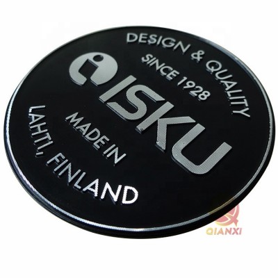 Painted, self-adhesive, diamond cut aluminum nameplate logo