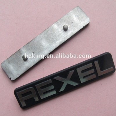 Diamond cut label, painted die struck aluminum nameplate with studs